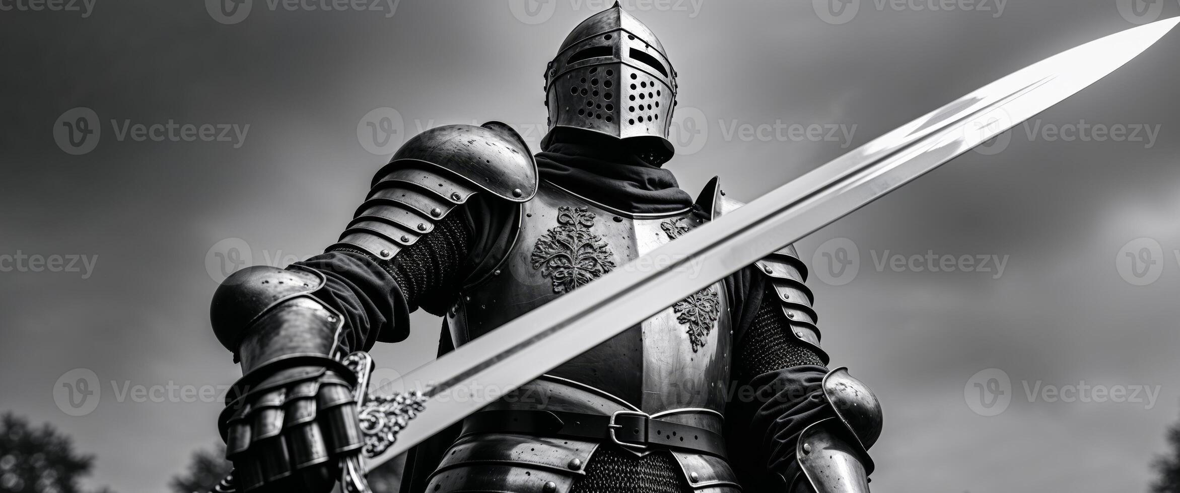 A black and white photo of a knight holding a sword