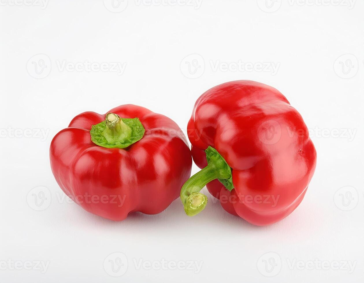 Two ripe red bell peppers isolated on white background perfect for healthy recipes and cooking photo