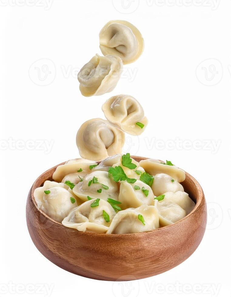 Delicious Homemade Dumplings Falling into Wooden Bowl Garnish with Fresh Parsley photo