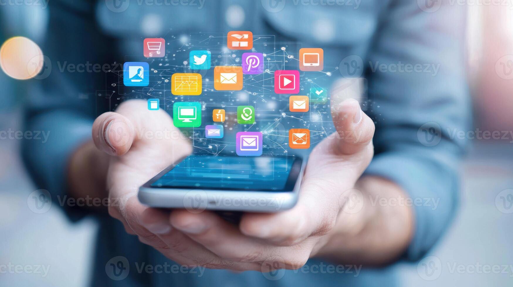 A person holding a smartphone with a holographic interface of social media icons photo