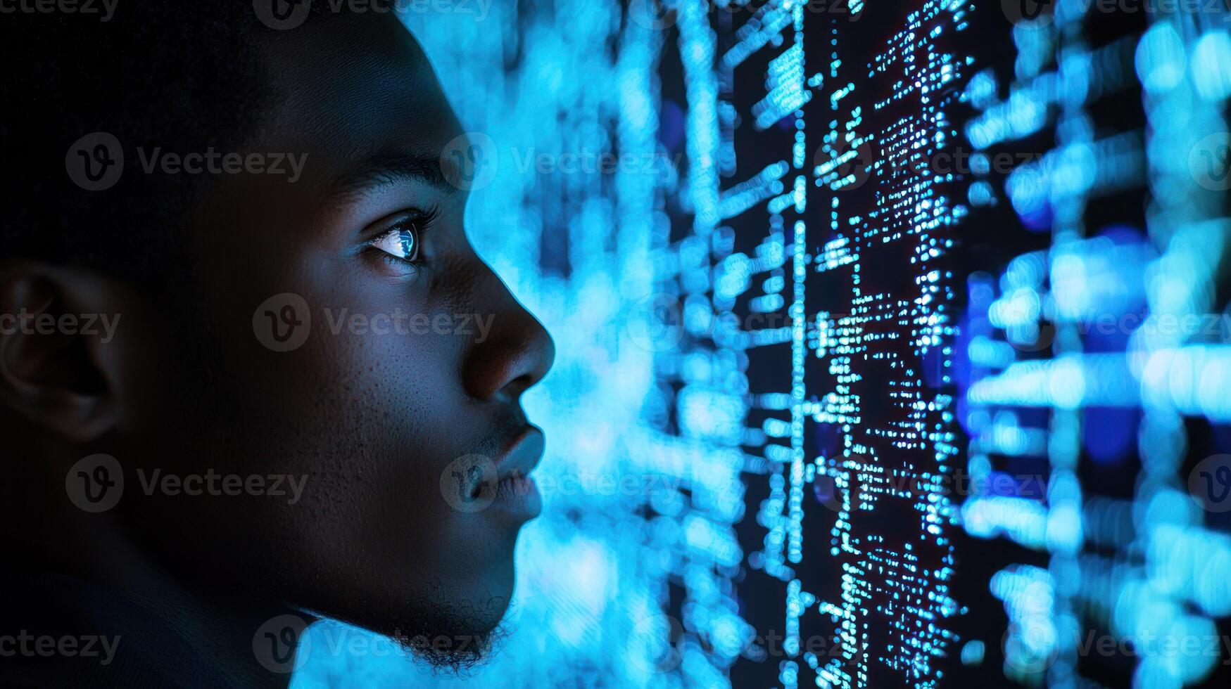 A young man looking at a digital screen with blue and white data patterns. photo