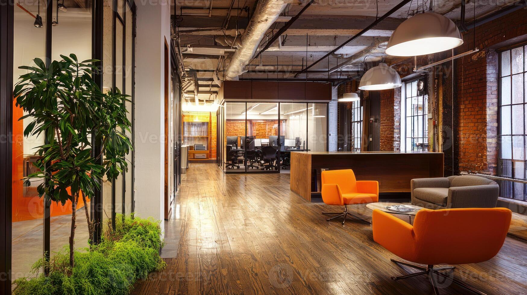 A spacious office space with wooden floors, glass partitions, and orange chairs, featuring a large window with green plants and a brick wall in the background. photo