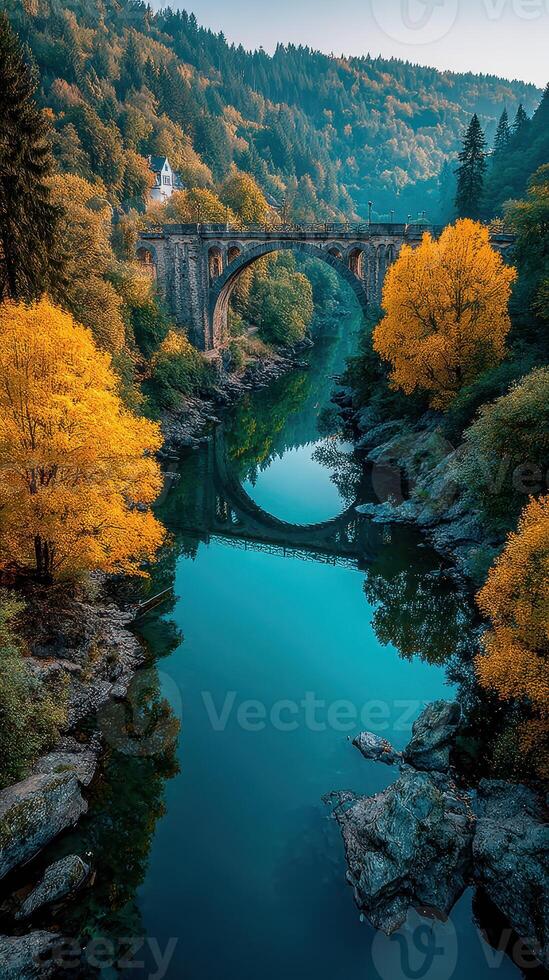Stunning autumn landscape showcasing a bridge and river surrounded by vibrant foliage in a serene setting photo