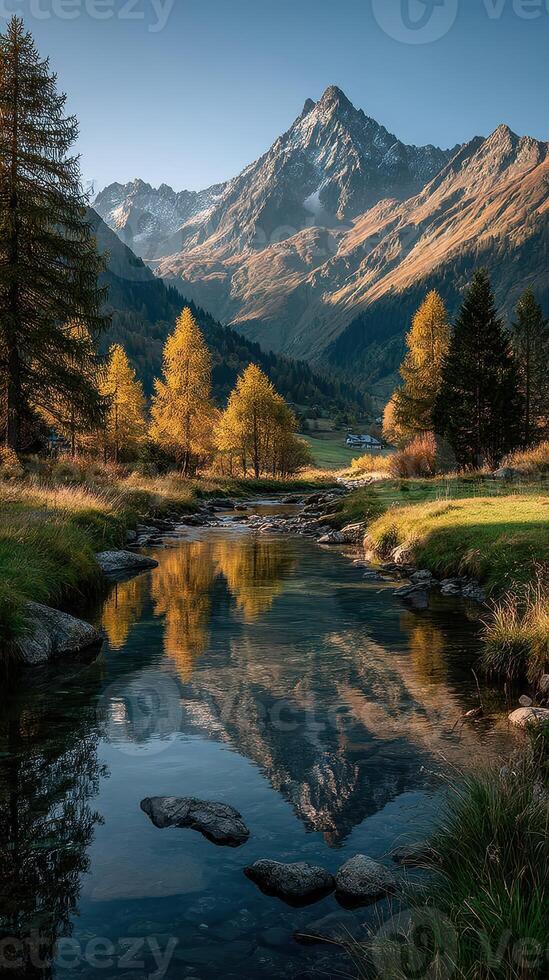 Autumn landscape with mountains and river reflecting trees in a tranquil setting photo