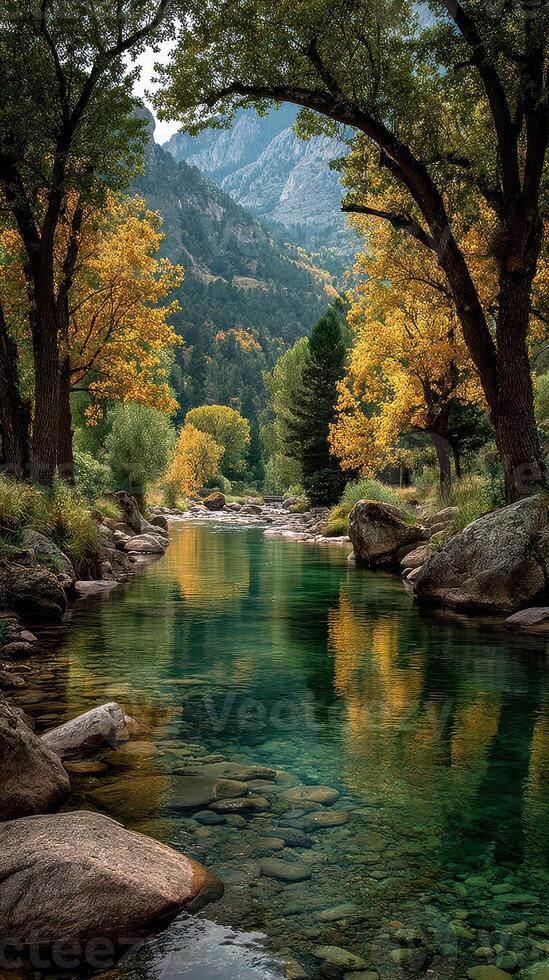Autumn colors reflecting in a tranquil river surrounded by rocky landscapes in a mountainous region photo