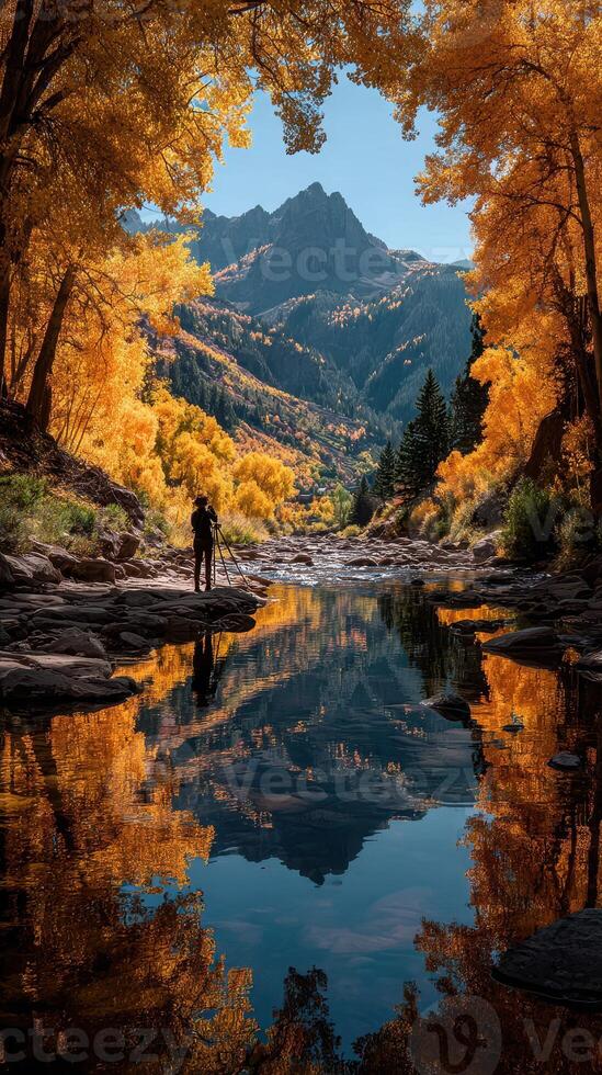 Capturing autumn beauty in a serene river landscape with vibrant yellow trees and mountain reflections photo