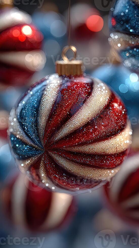 Colorful holiday ornaments hanging amidst shimmering decorations in a festive setting photo