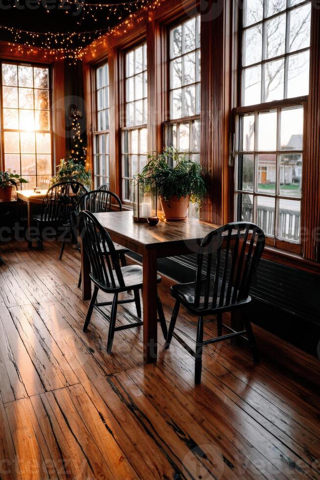 Cozy dining area with sunlight streaming through windows photo