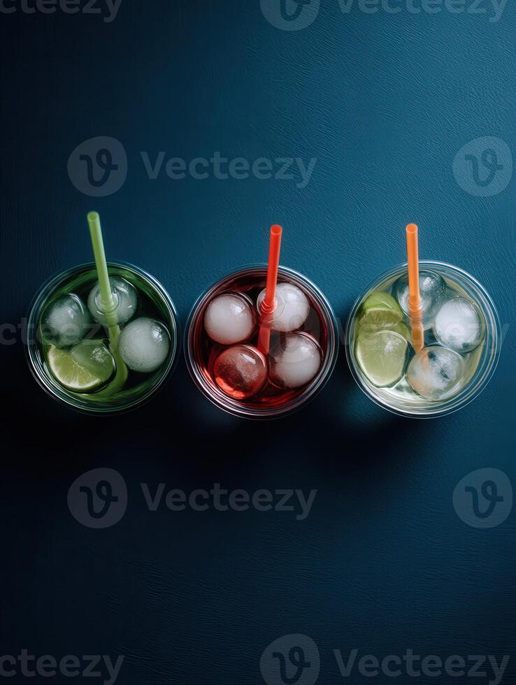 Refreshing trio of colorful drinks with ice and citrus photo
