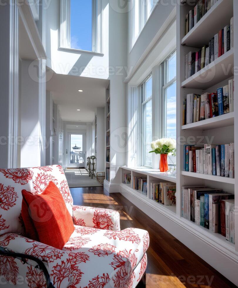 A chair and bookshelves in a room with windows photo