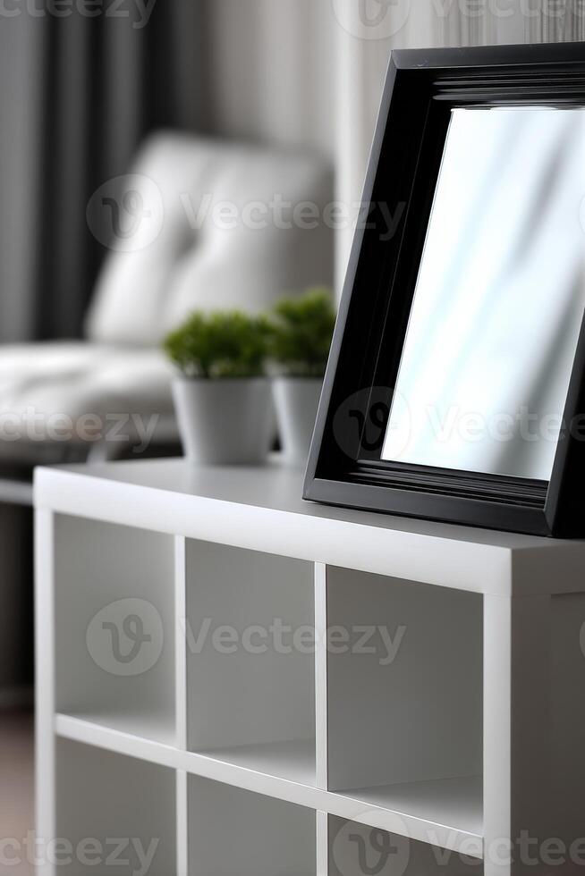 A white shelf with a mirror on top photo
