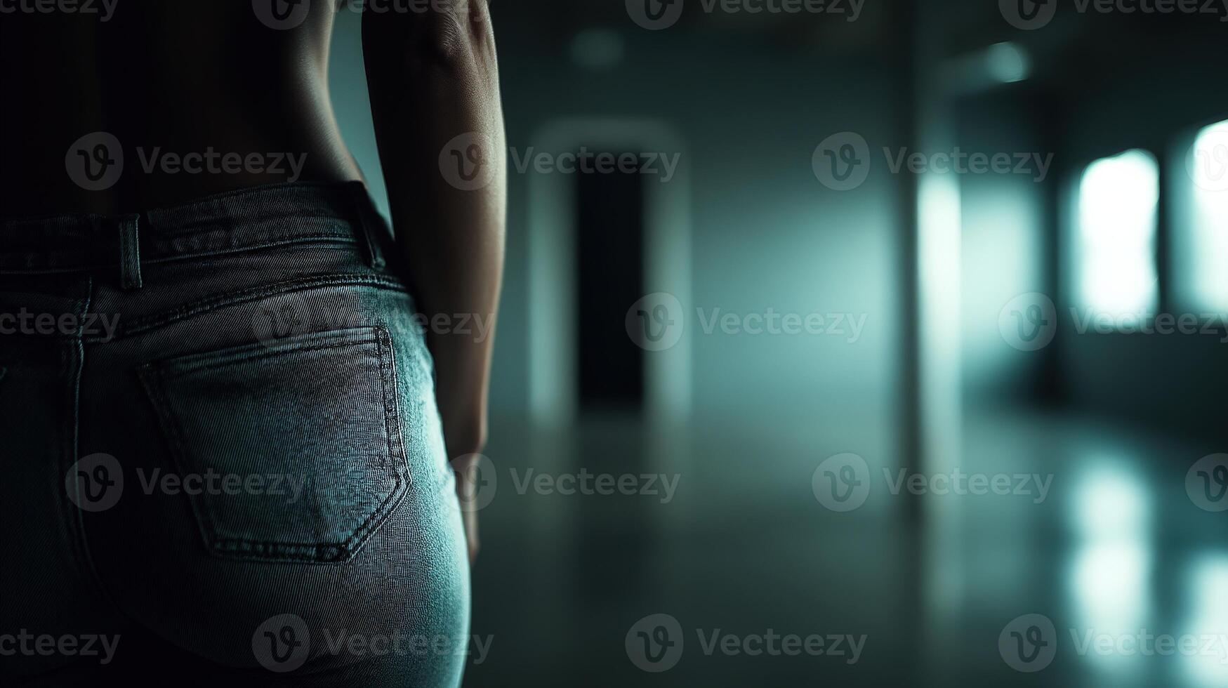 Stylish jeans highlight curves in an empty urban setting during evening photo