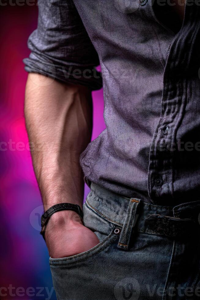 Stylish individual showcasing a casual outfit with jeans and shirt photo