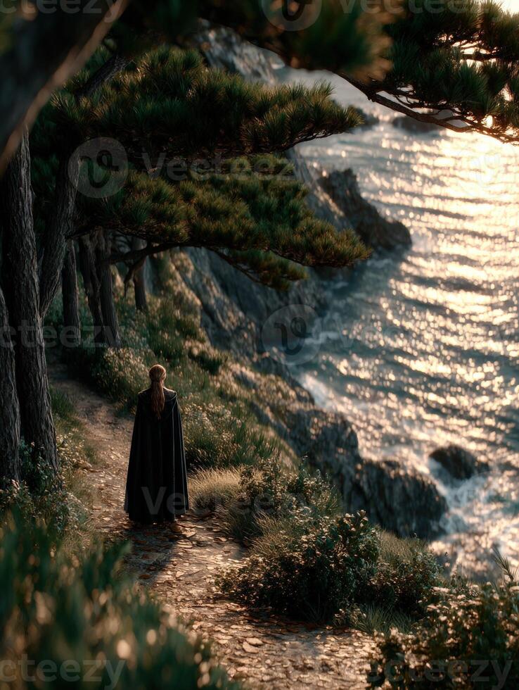 Viking woman walks along the coastal path during sunset photo