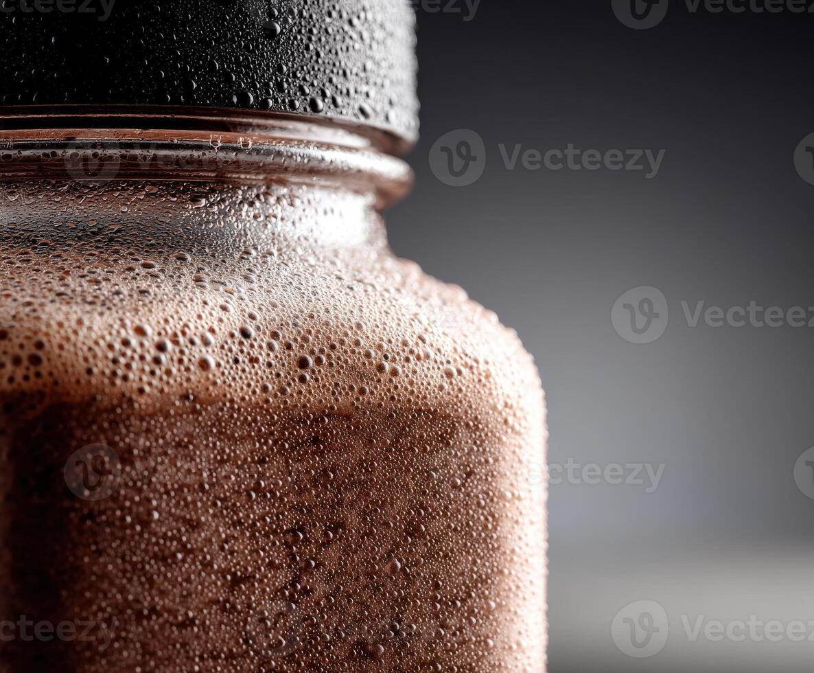 Refreshing protein shake in a glass jar with frothy texture photo