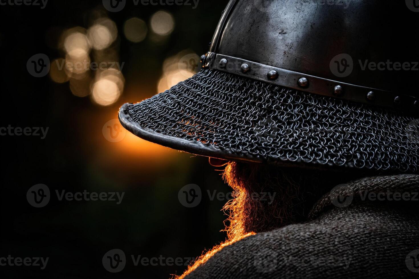 Warrior in medieval helmet during sunset in a forest photo