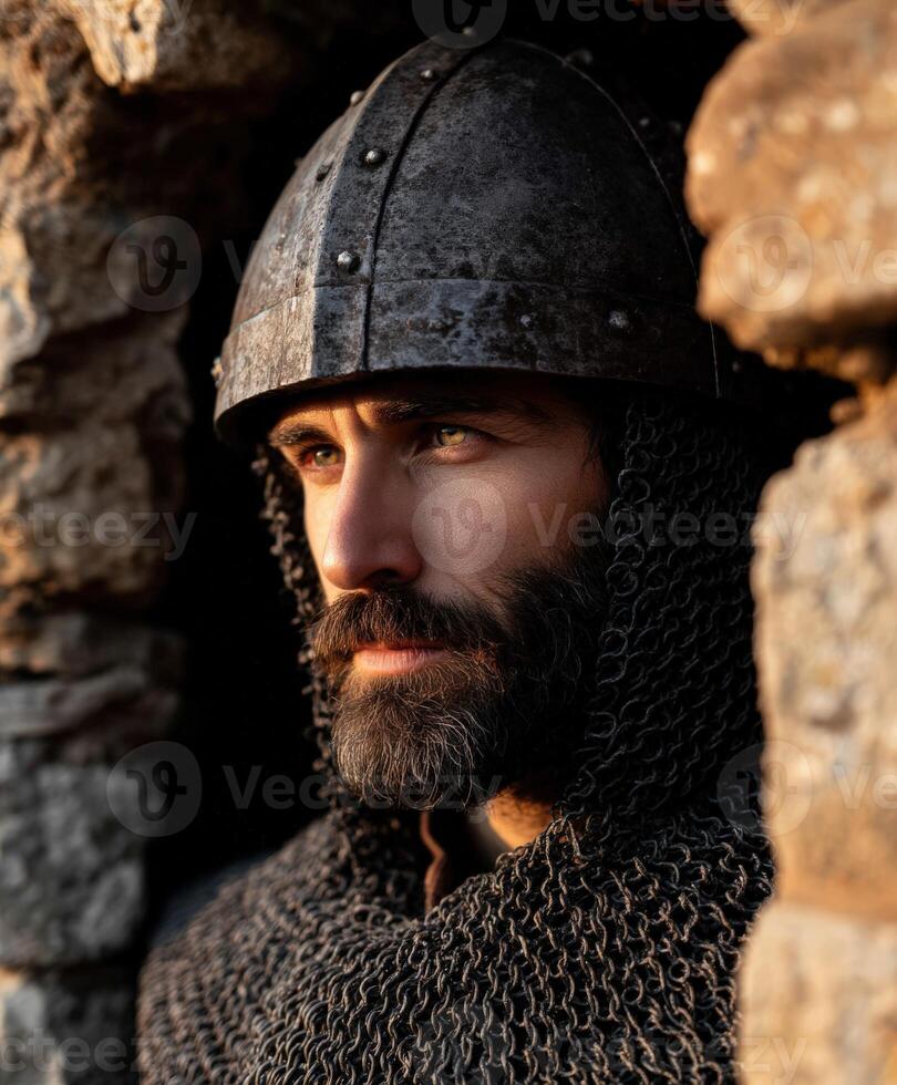 Historic warrior in armor gazing from stone fortress at sunset photo
