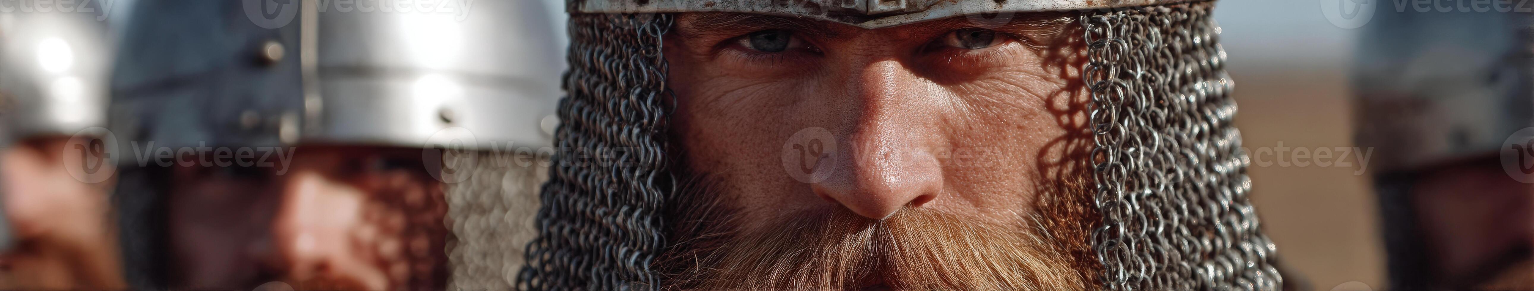 Brave warrior with chainmail helm displaying intense focus photo