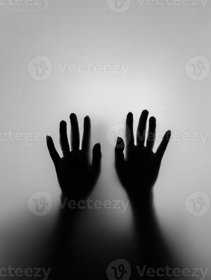 Hands reaching out against a soft, illuminated background photo