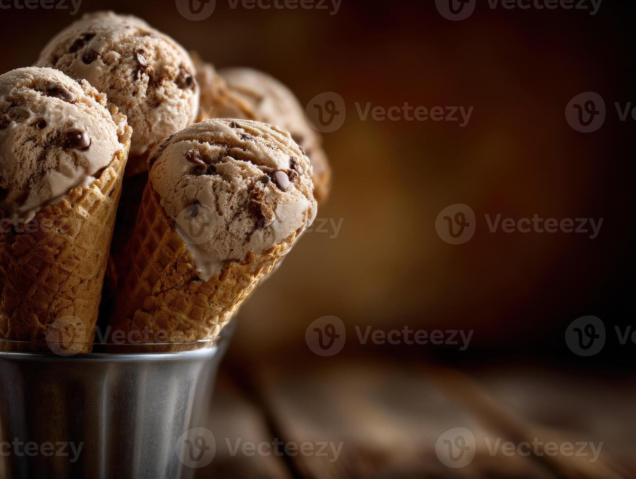 Delicious chocolate chip ice cream cones ready to enjoy in a rustic setting photo