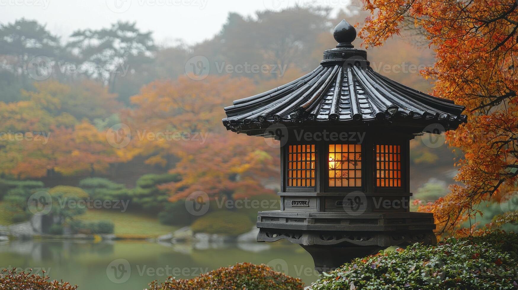A lantern is lit up in front of a pond photo