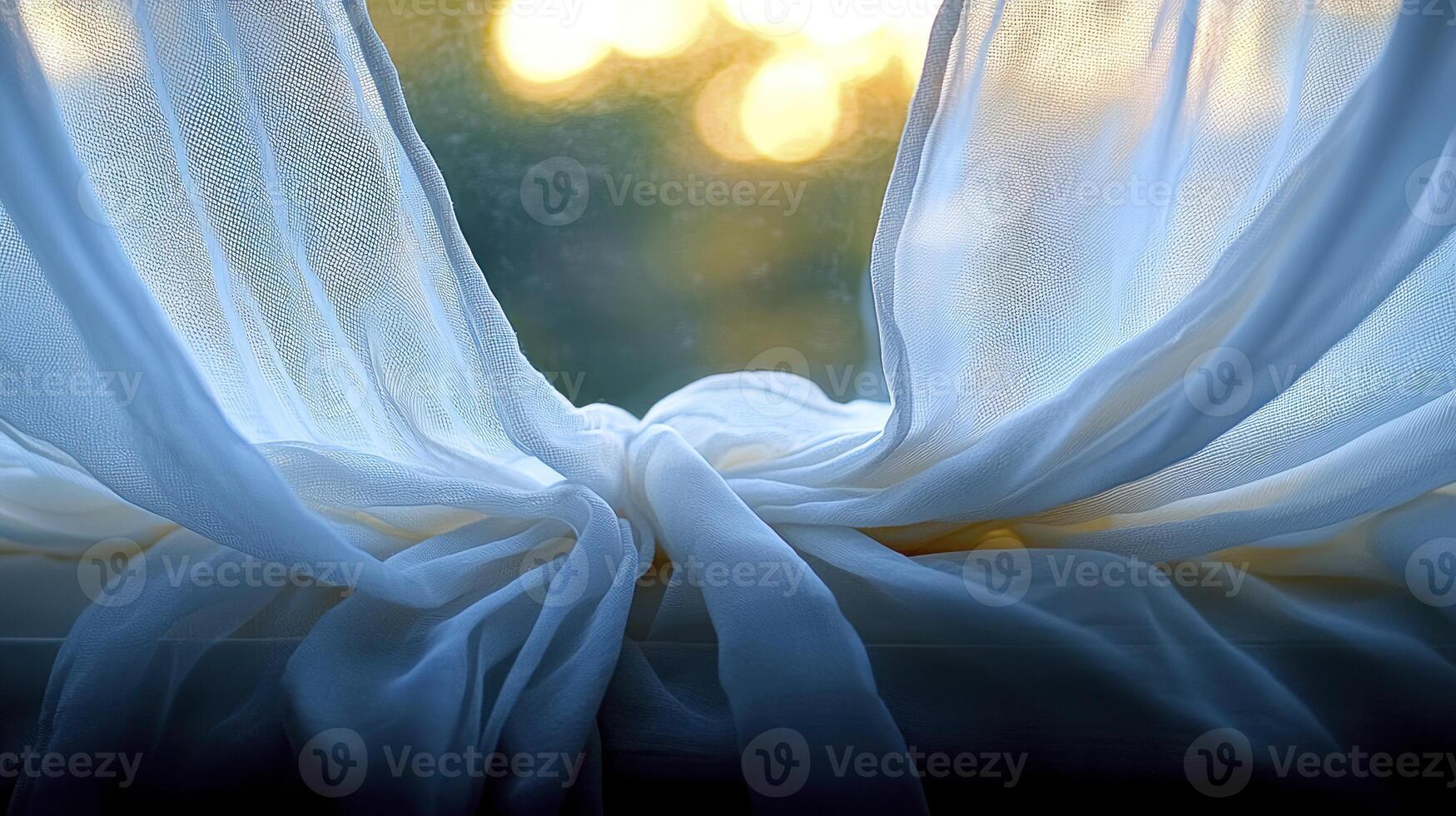 A window with a white curtain and a sun in the background photo