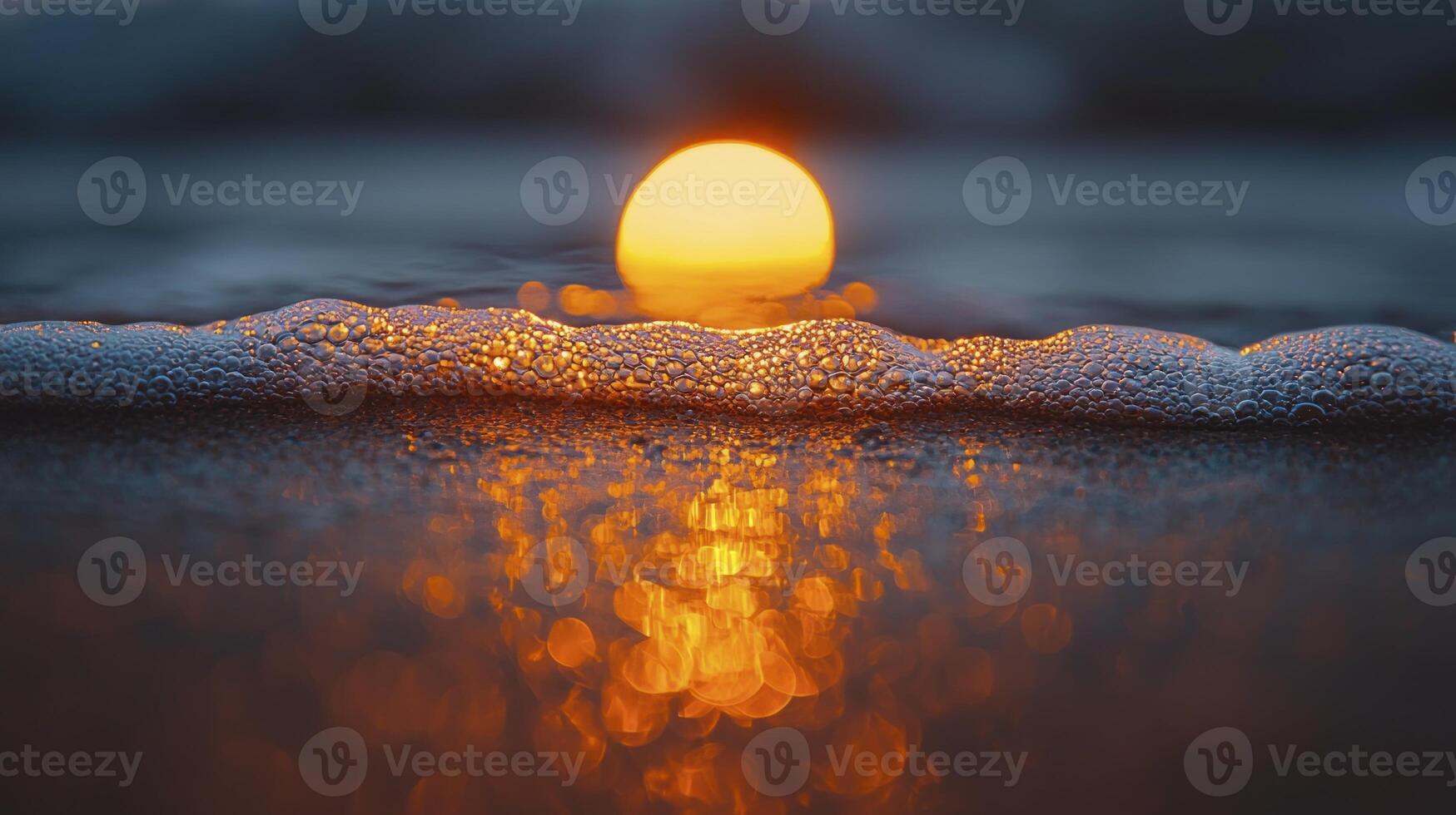 A candle is lit on the beach with foam photo