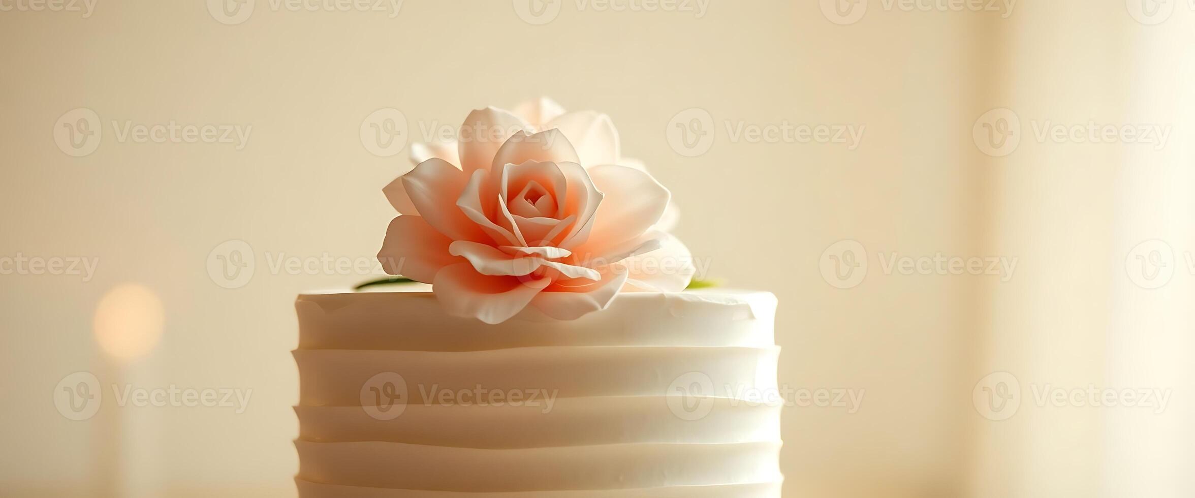 close up of a white cake with a flower on top photo