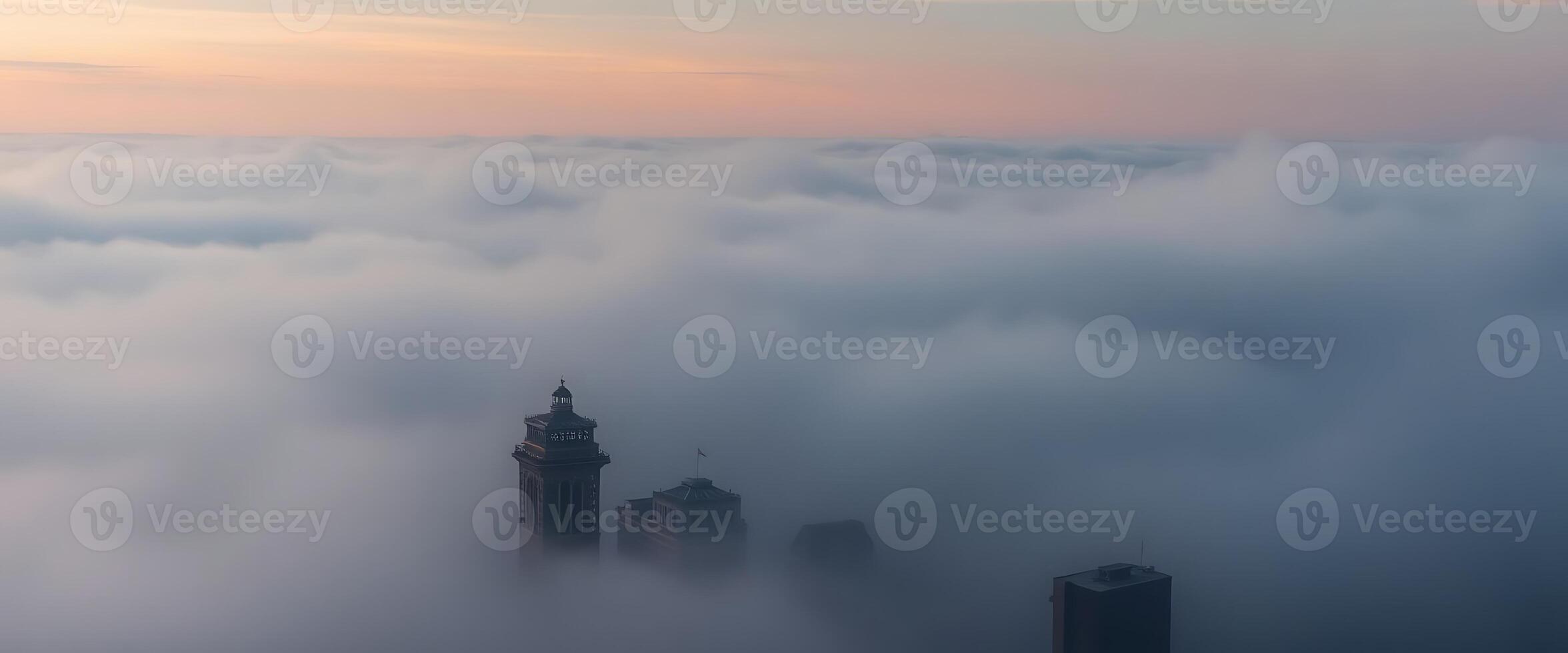 view of a city in the middle of a sea of clouds photo