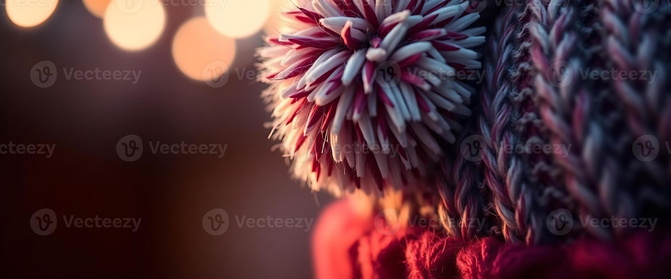close up of a knitted object with lights in the background photo