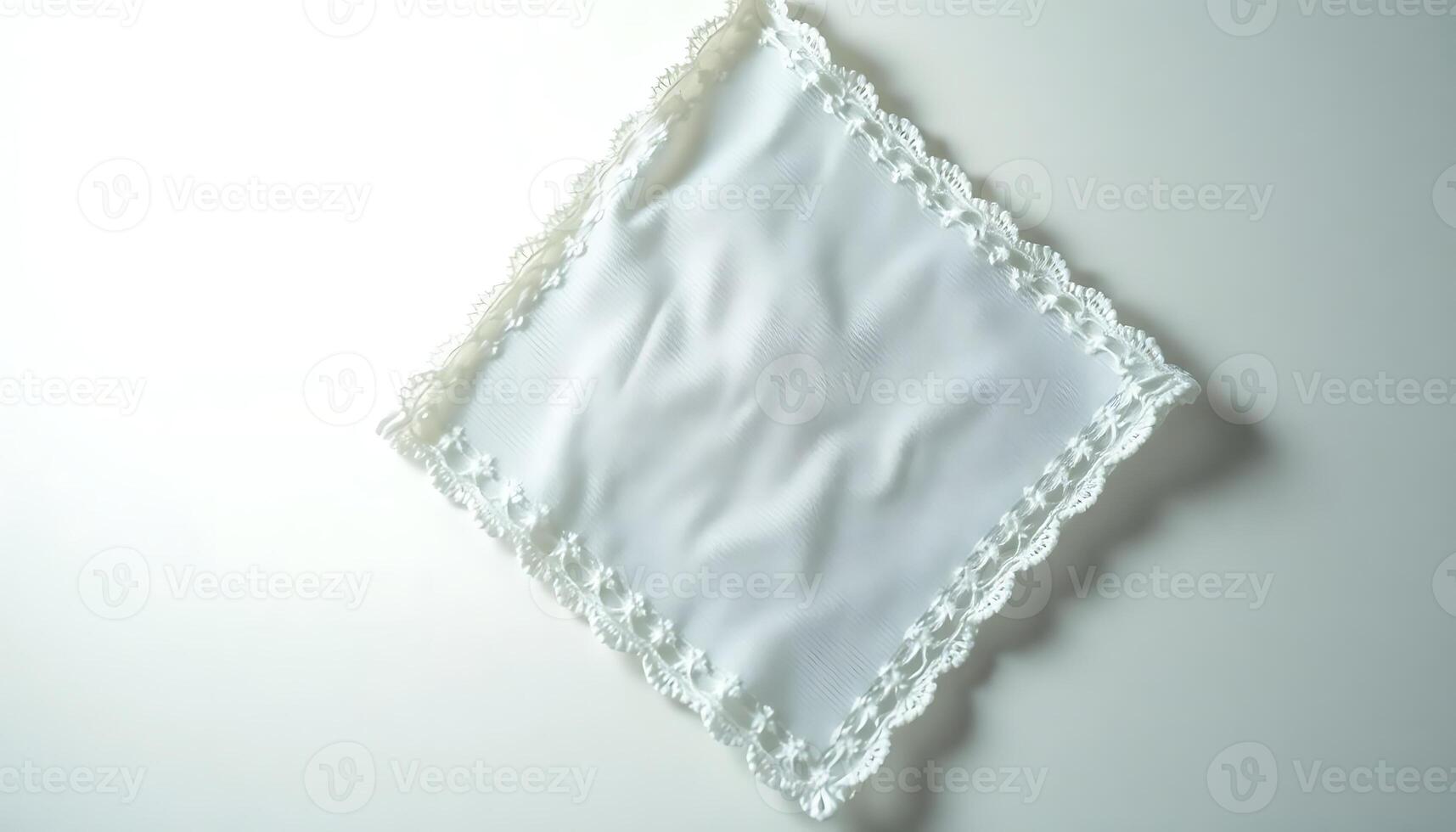 white cloth with a lace edge on a white surface photo