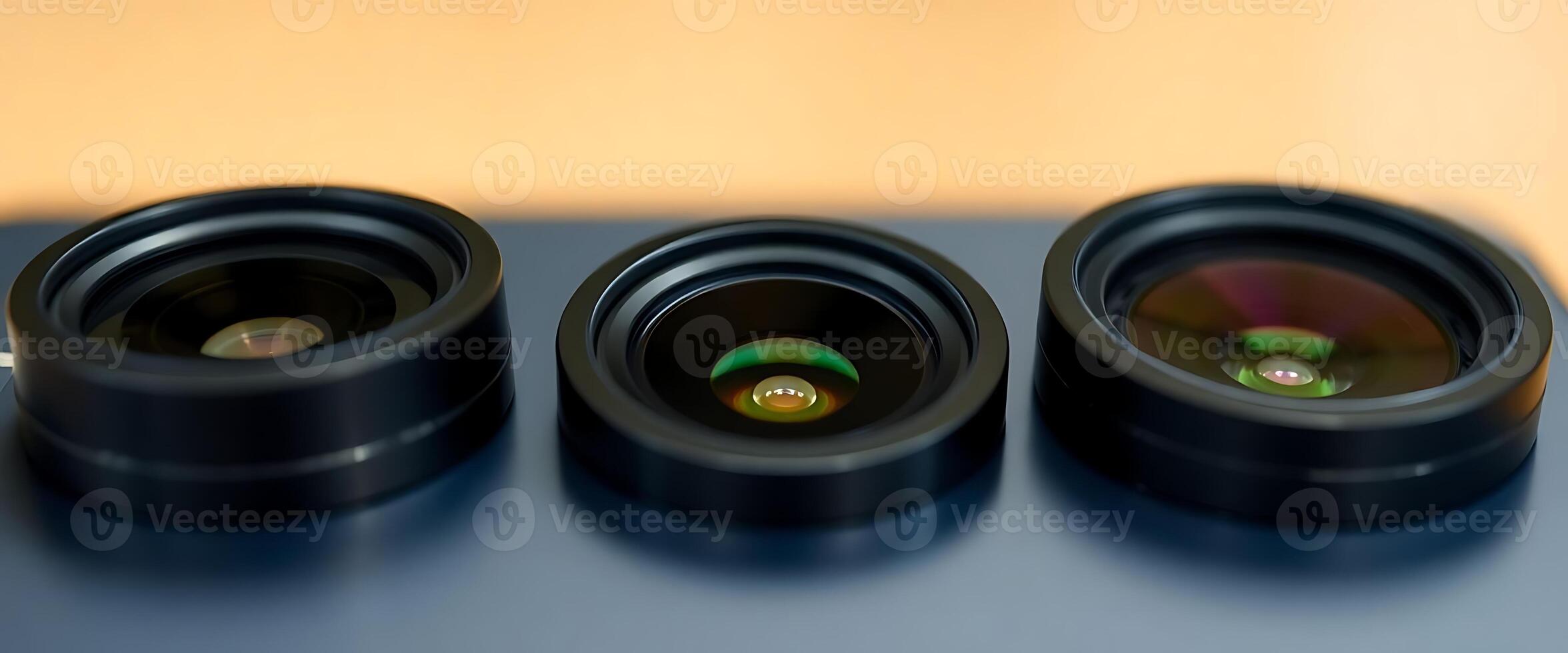 group of three black speakers sitting on top of a table photo