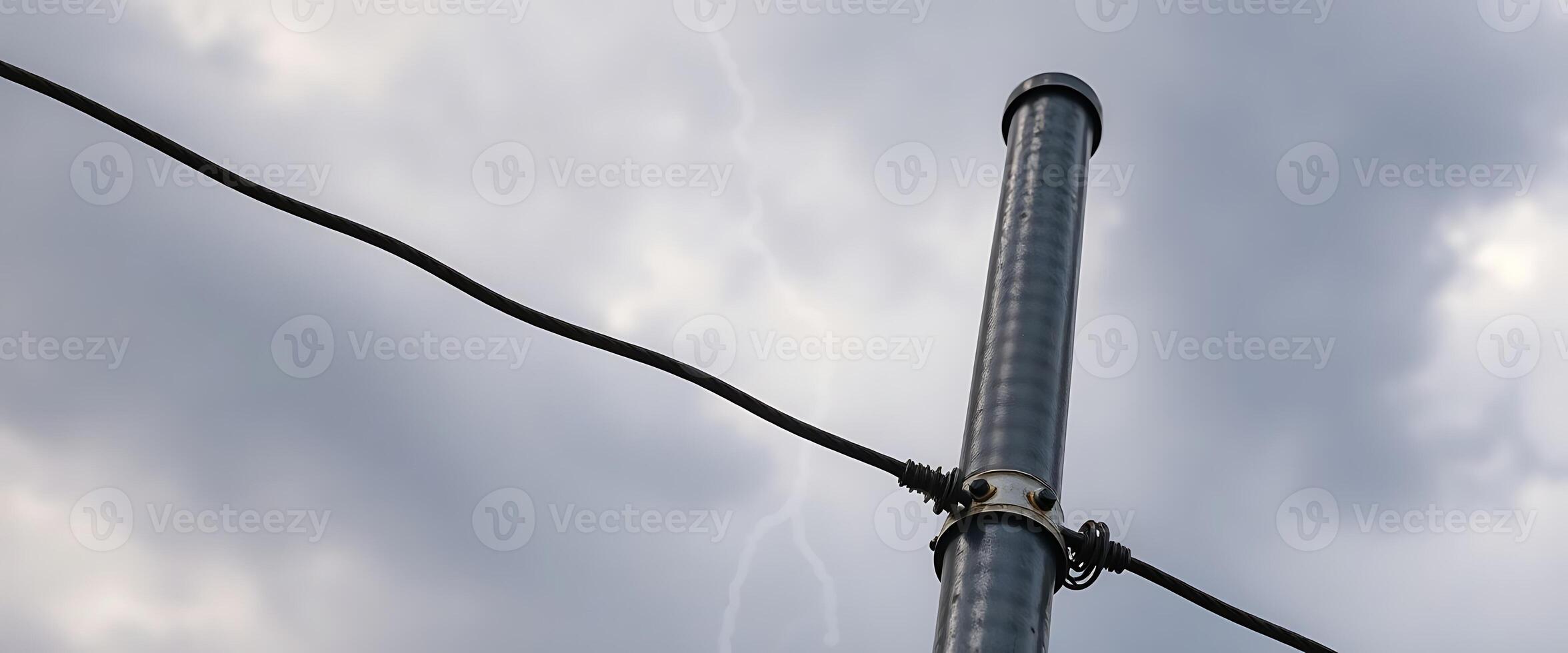 metal pole with a lightning bolt in the background photo