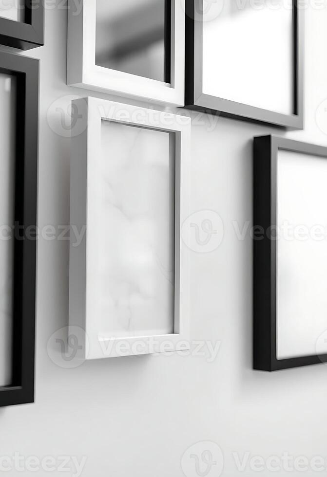 white wall with black framed pictures on it photo