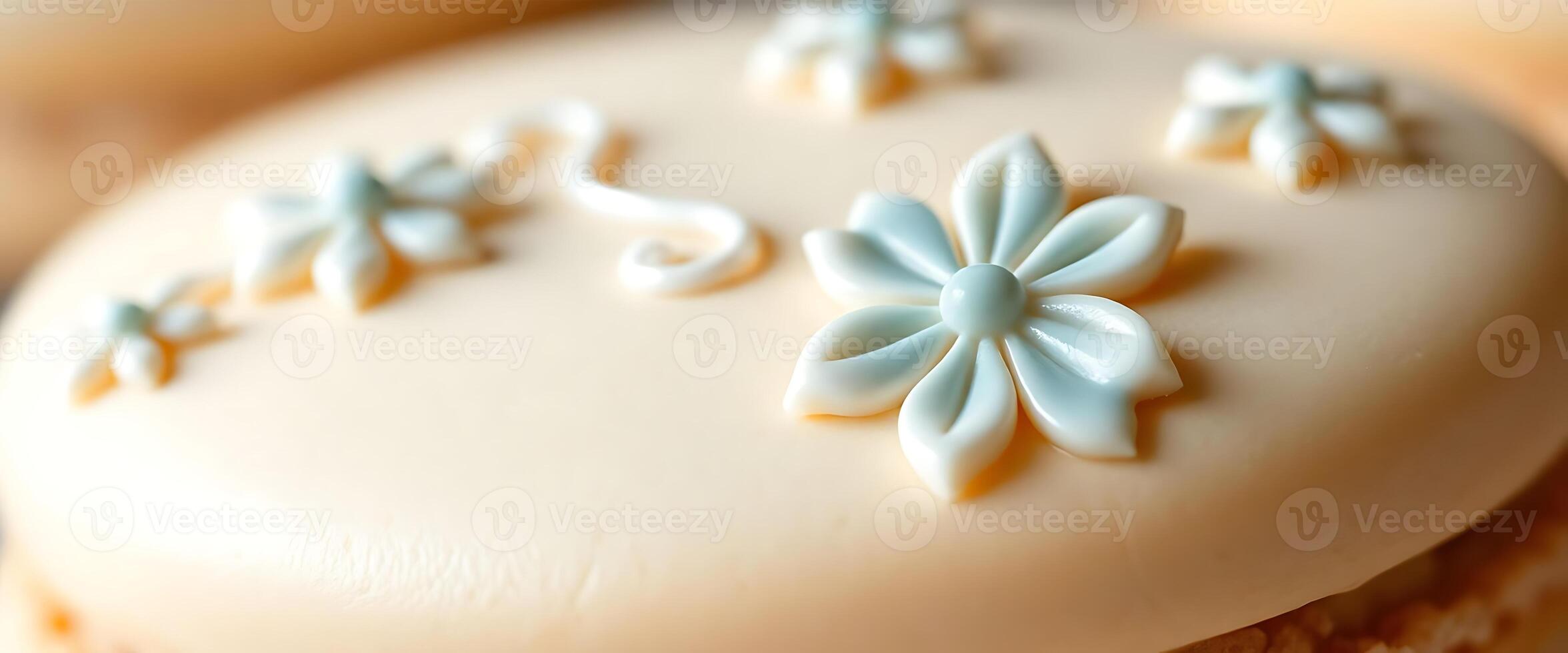close up of a frosted cupcake with flowers on it photo
