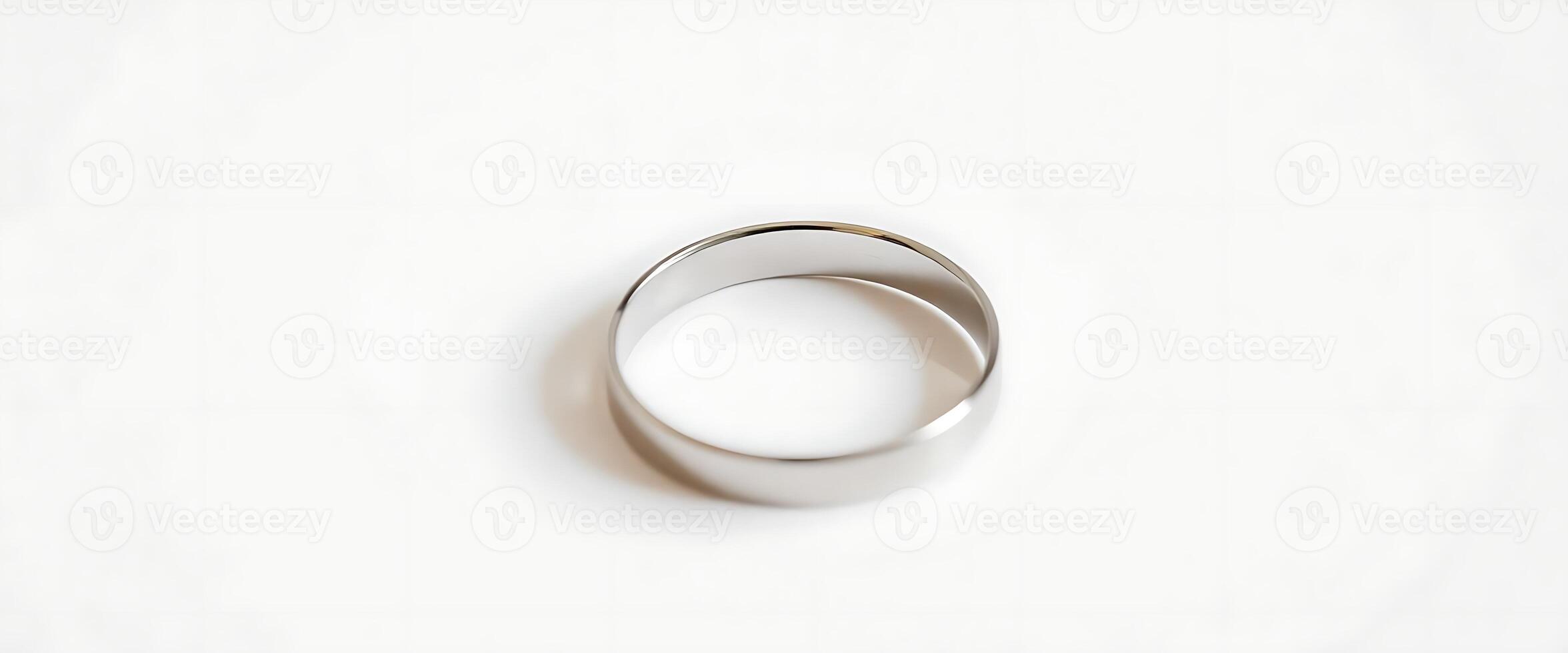 silver ring on a white surface photo