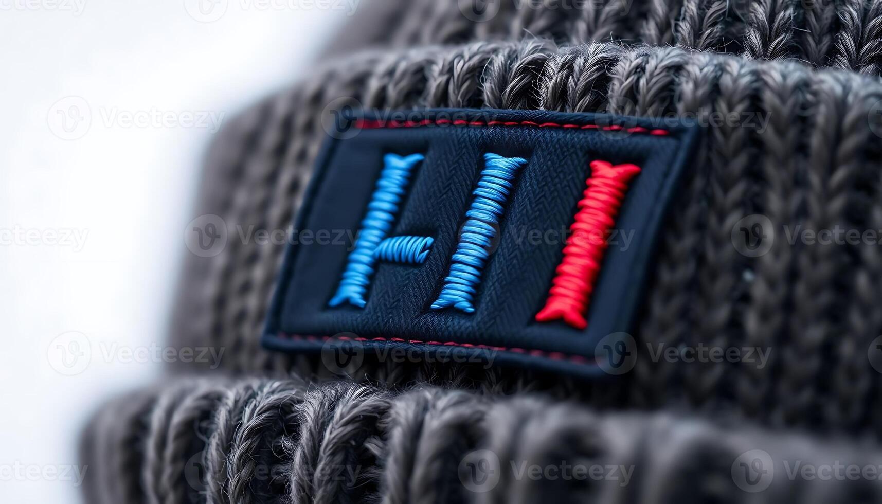 close up of a hat with a red and blue patch on it photo