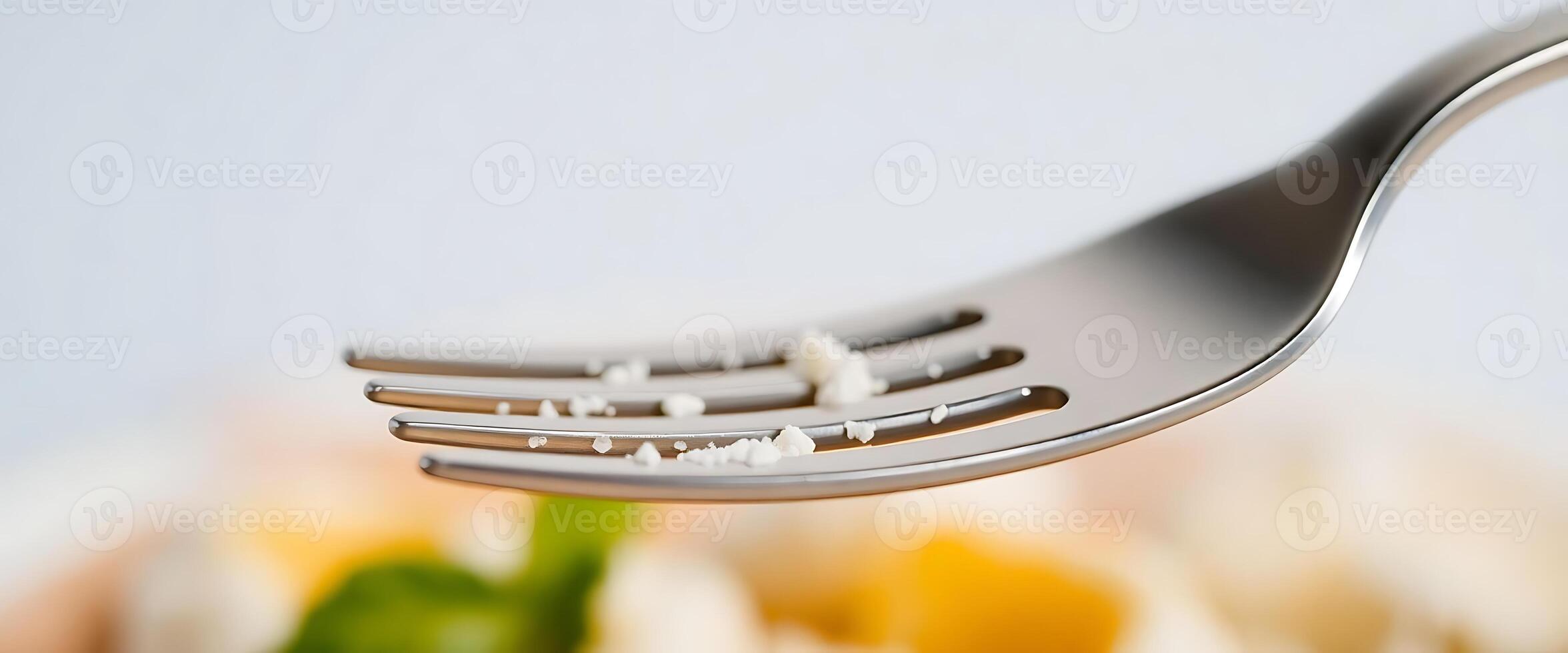 close up of a fork with food on it photo