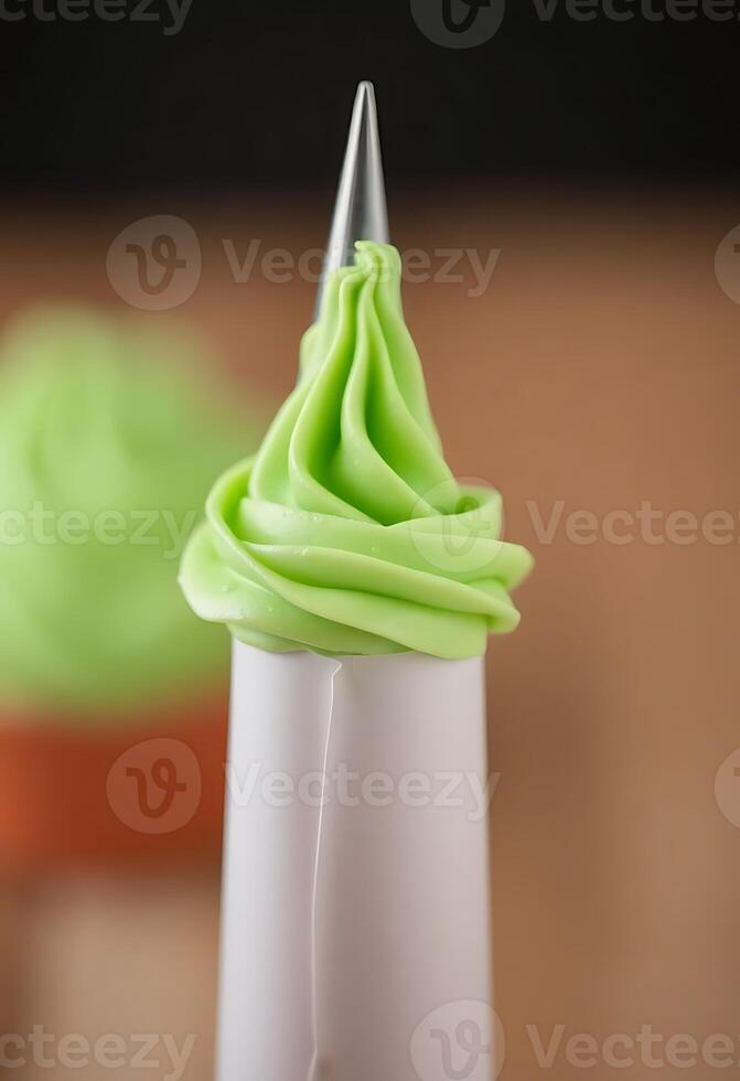 cupcake with green frosting on top of it photo