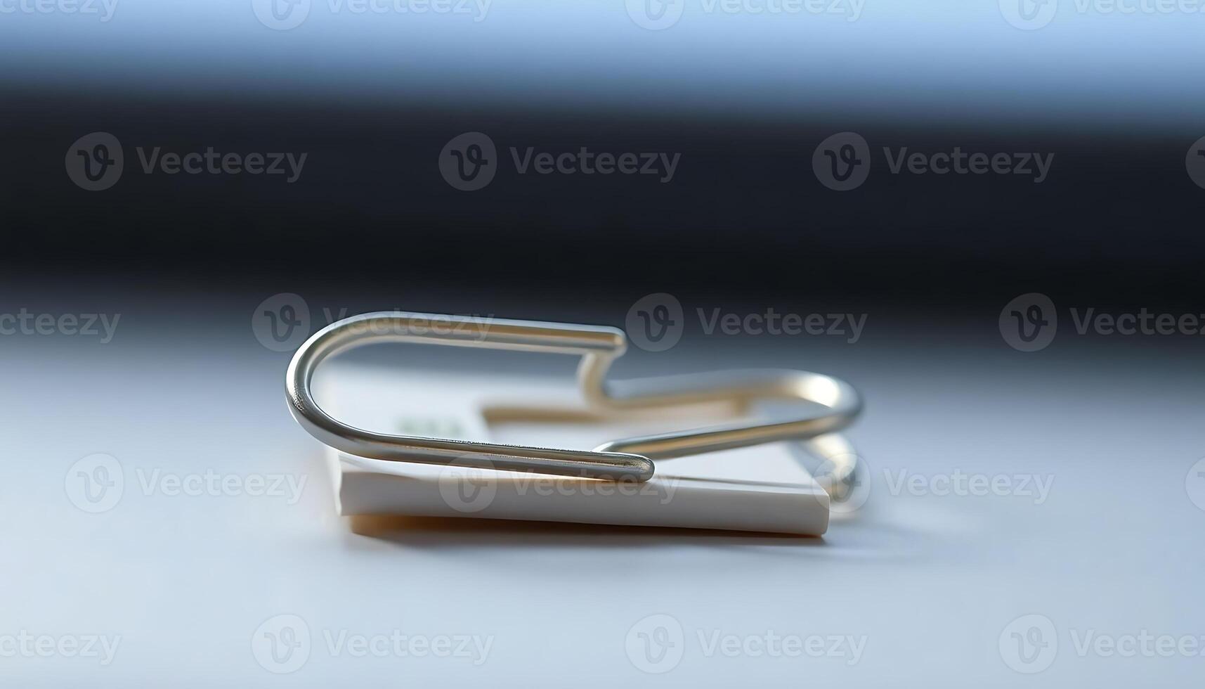 pair of metal clips sitting on top of a table photo