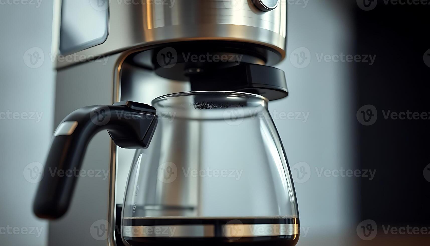 coffee maker with a glass carafe in front of it photo