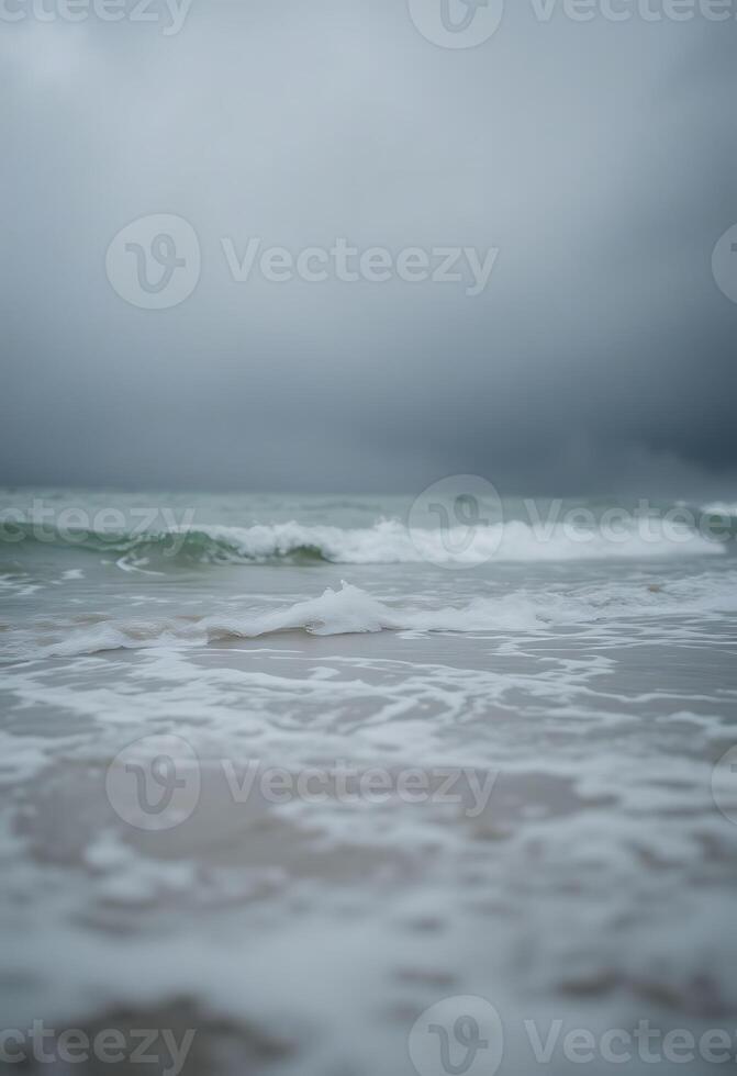 view of a body of water with waves coming in photo