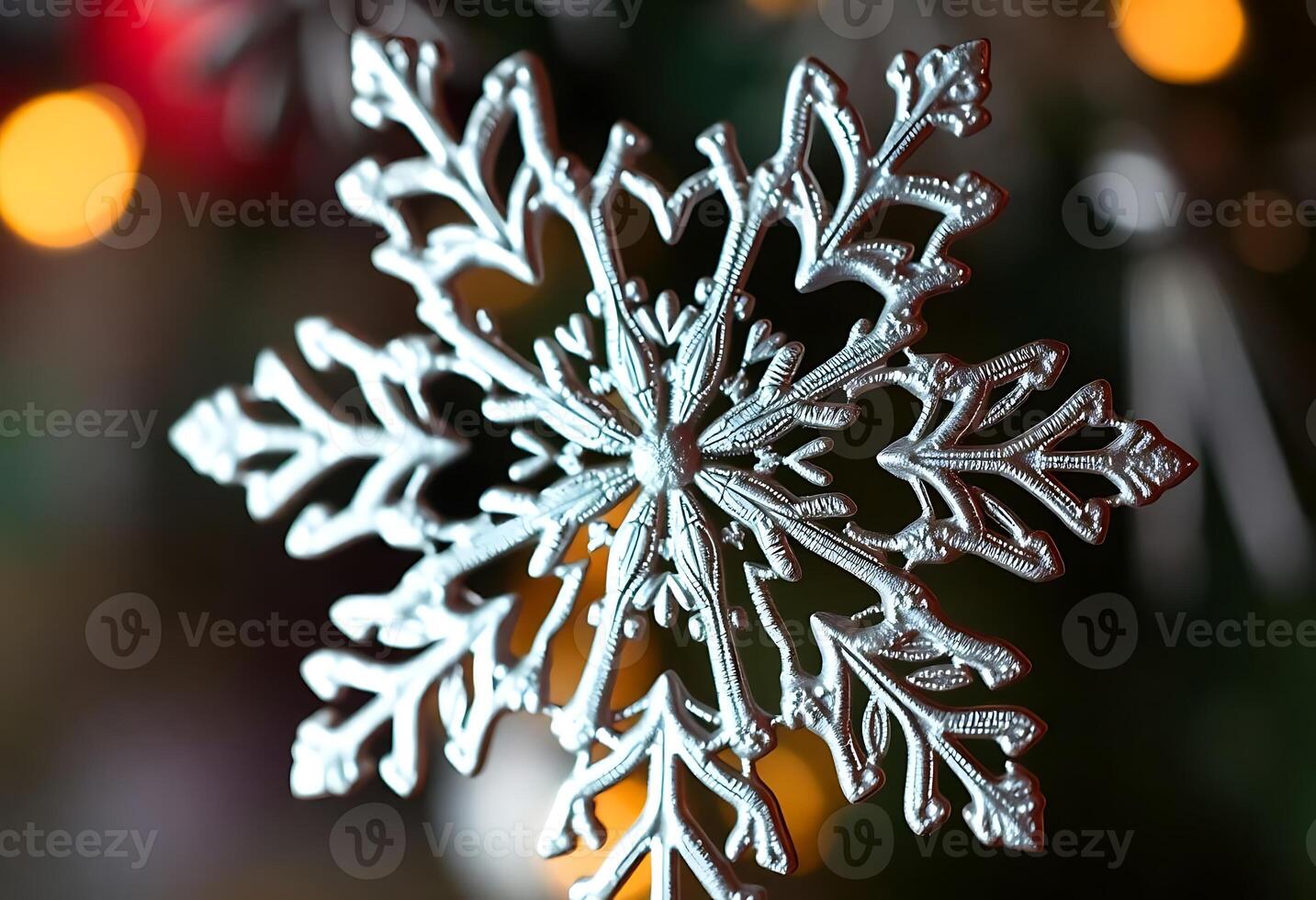 close up of a snowflake on a christmas tree photo