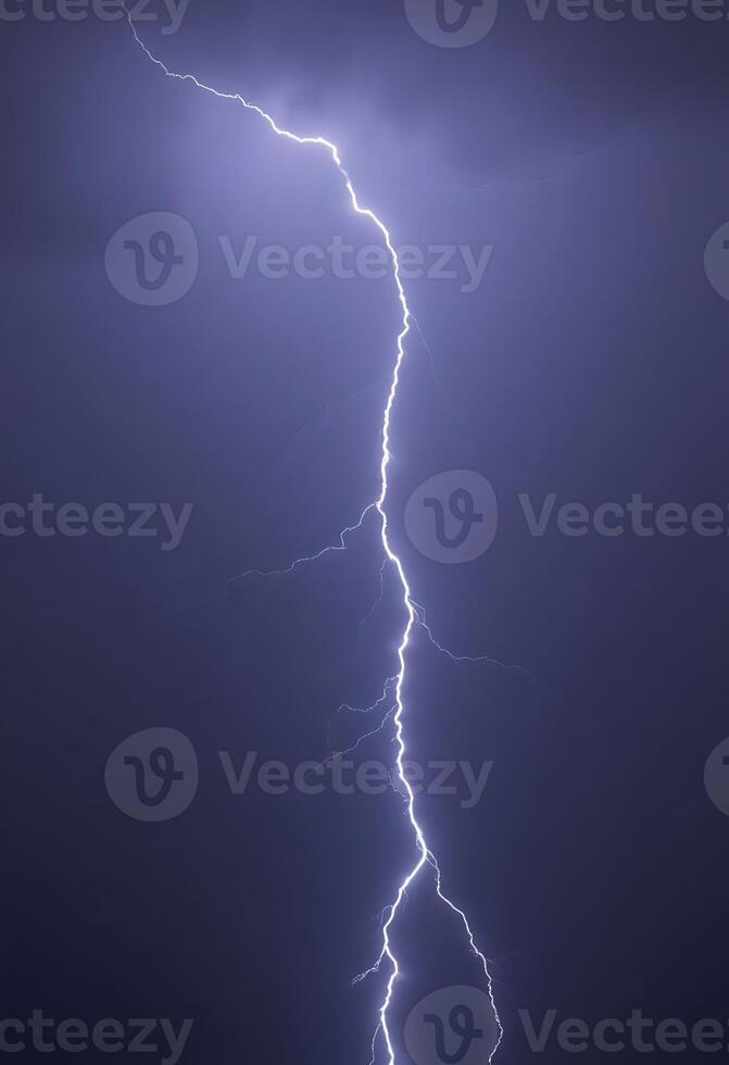 lightning bolt striking across a dark sky photo
