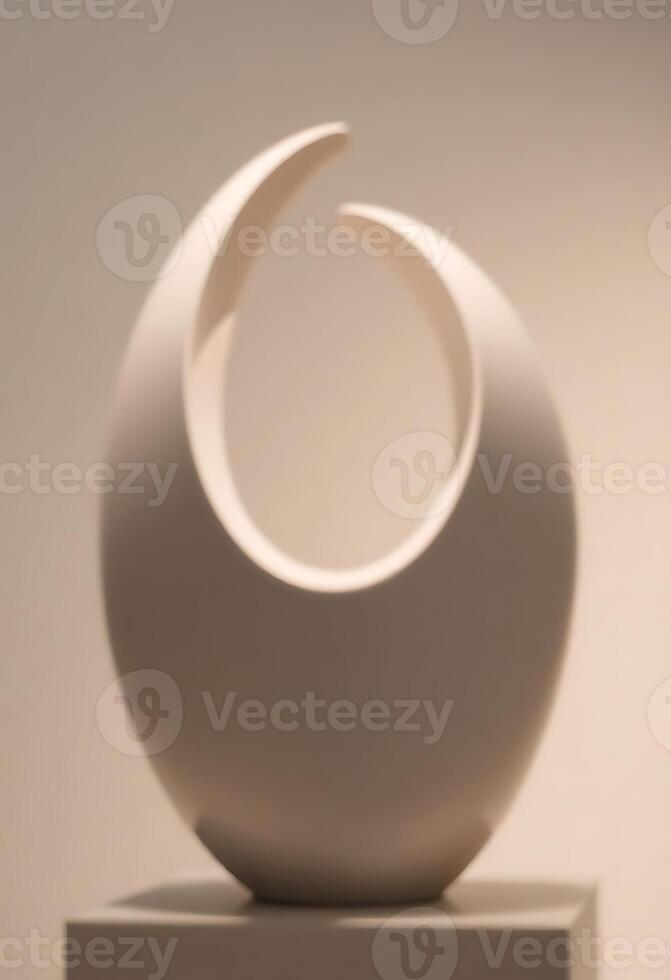 white sculpture sitting on top of a white pedestal photo