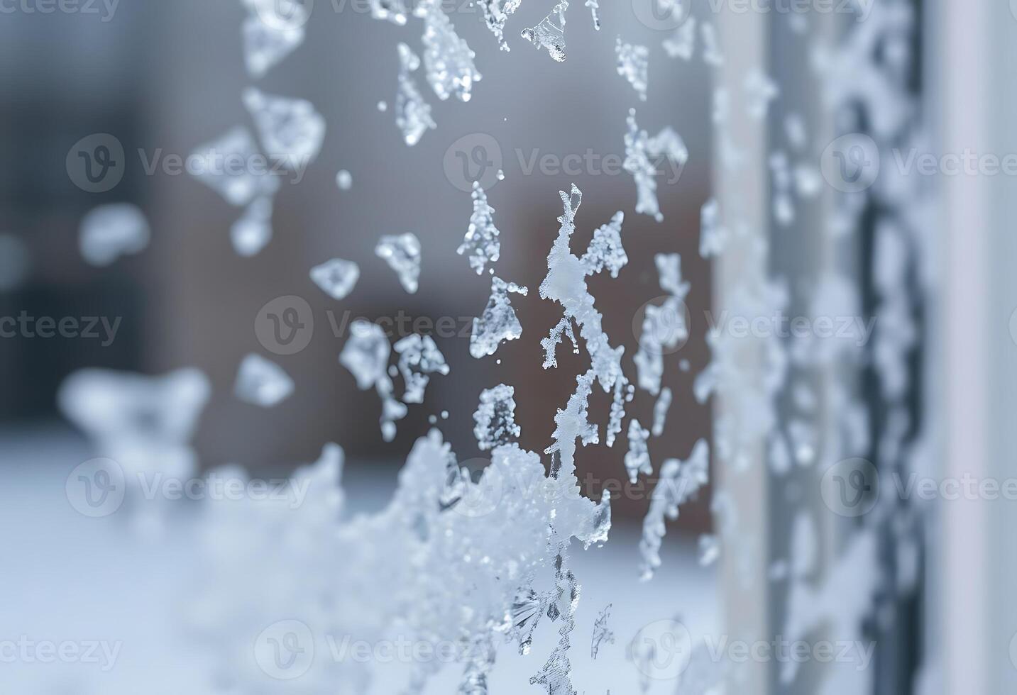 close up of a frosted window with a building in the background photo