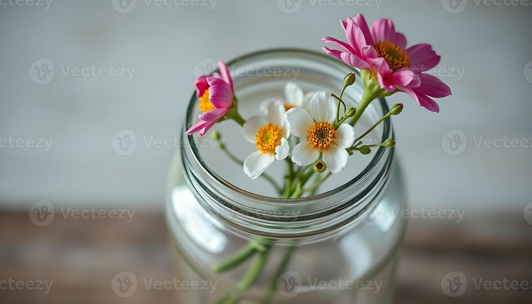 close up of a vase with flowers in it photo