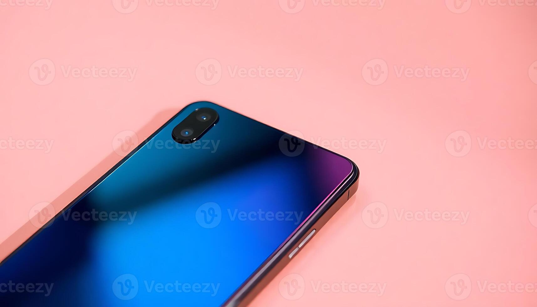 close up of a cell phone on a pink surface photo