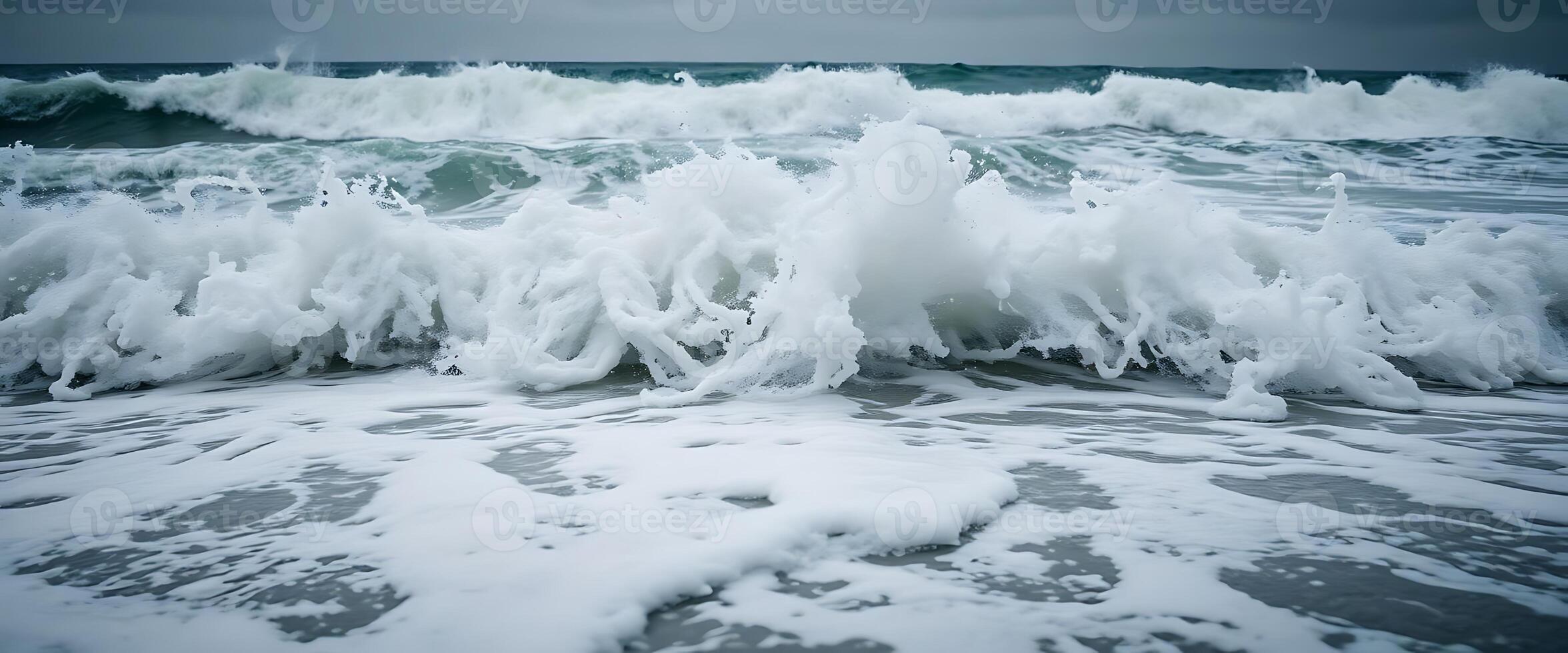 large wave crashing into the shore of the ocean photo