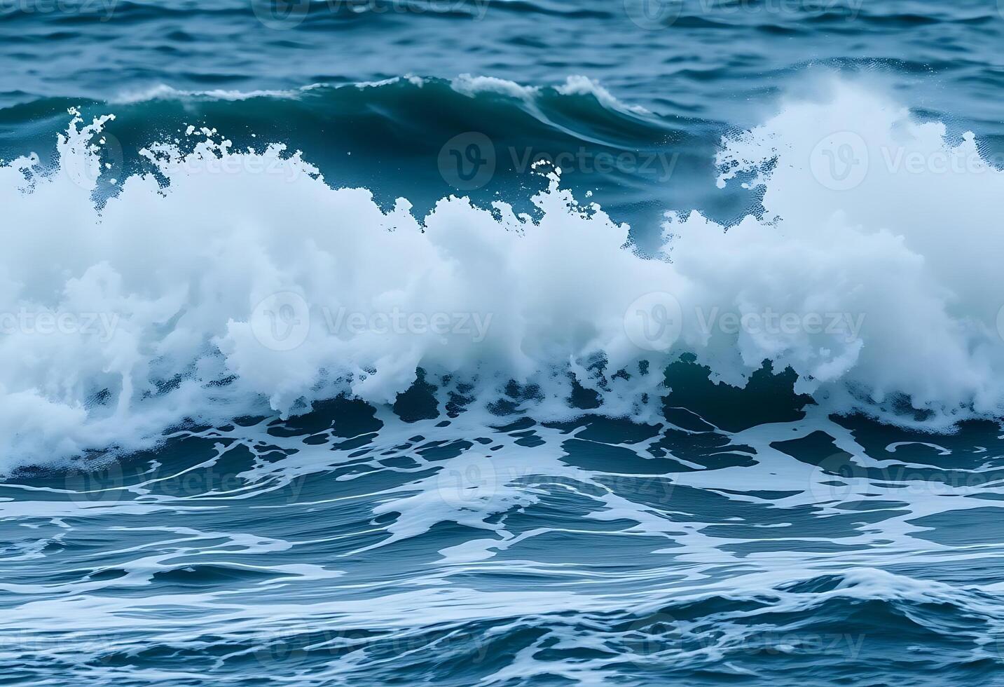 wave is breaking over the top of the ocean photo